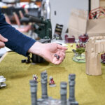 Steve Rowan plays “Warhammer 40,000” at Four Horseman in the Morgantown Mall on Saturday.